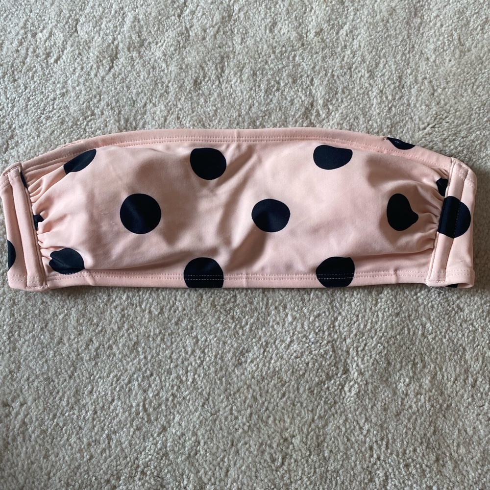 polka doted pink strapless swimsuit